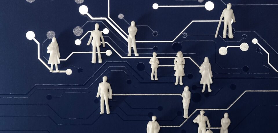 miniature-figures-on-a-blue-computer-chip-backgrou-2026-01-07-01-46-22-utc